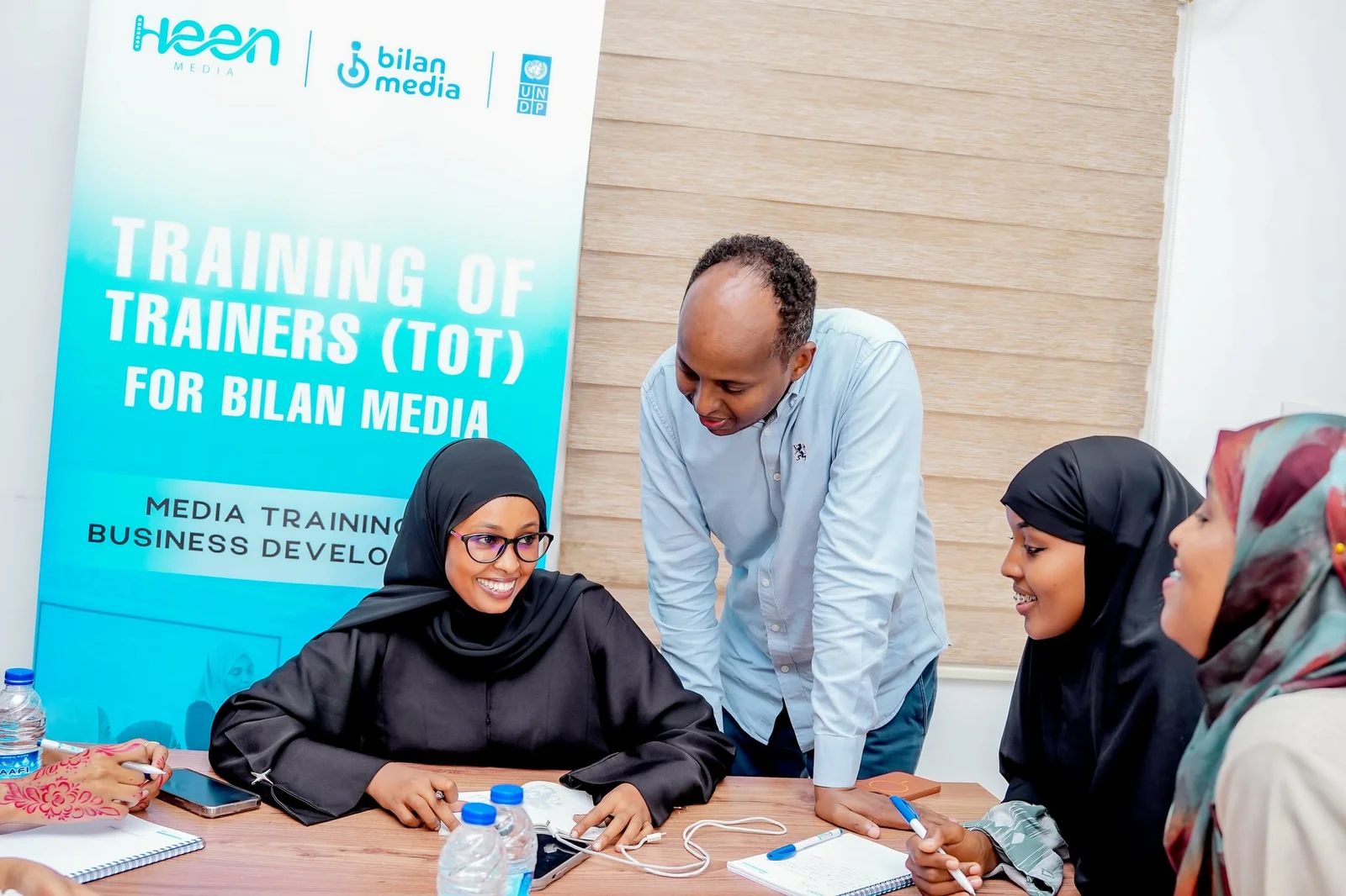 A facilitator guiding participants during the Training of Trainers for Bilan Media in Mogadishu.