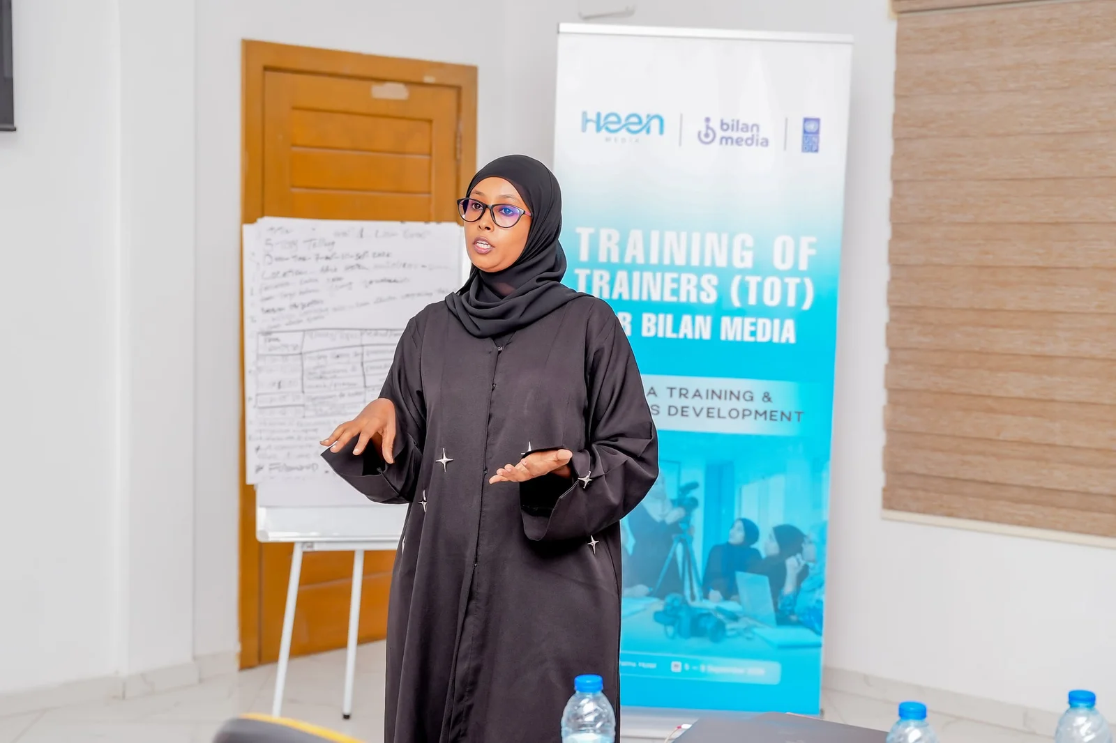 A participant presenting to the group during the Training of Trainers for Bilan Media.