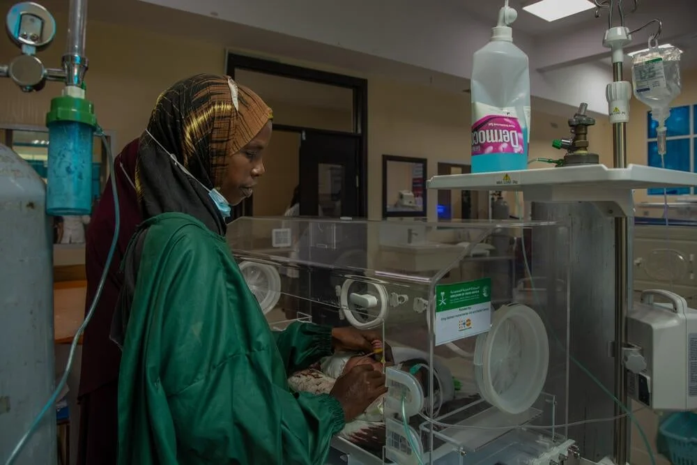 A mother beside her baby’s incubator at Banadir Hospital in Mogadishu.