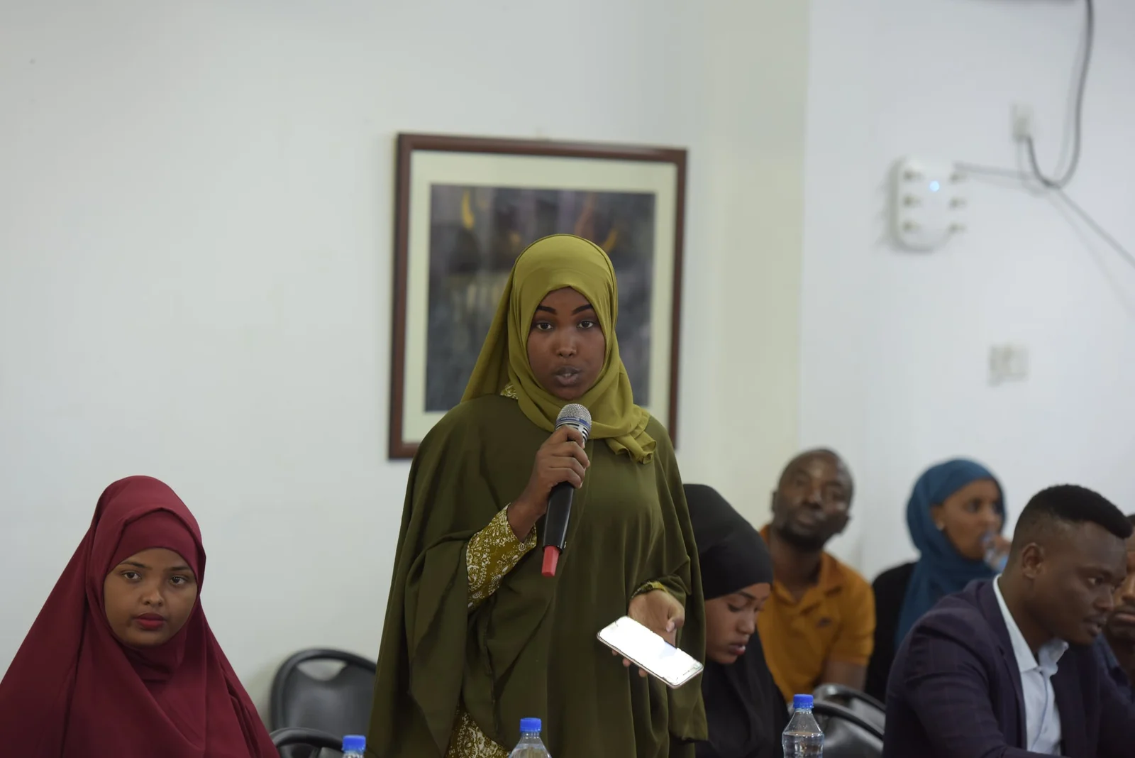 A Somali journalist asking a question at a press briefing in Mogadishu.