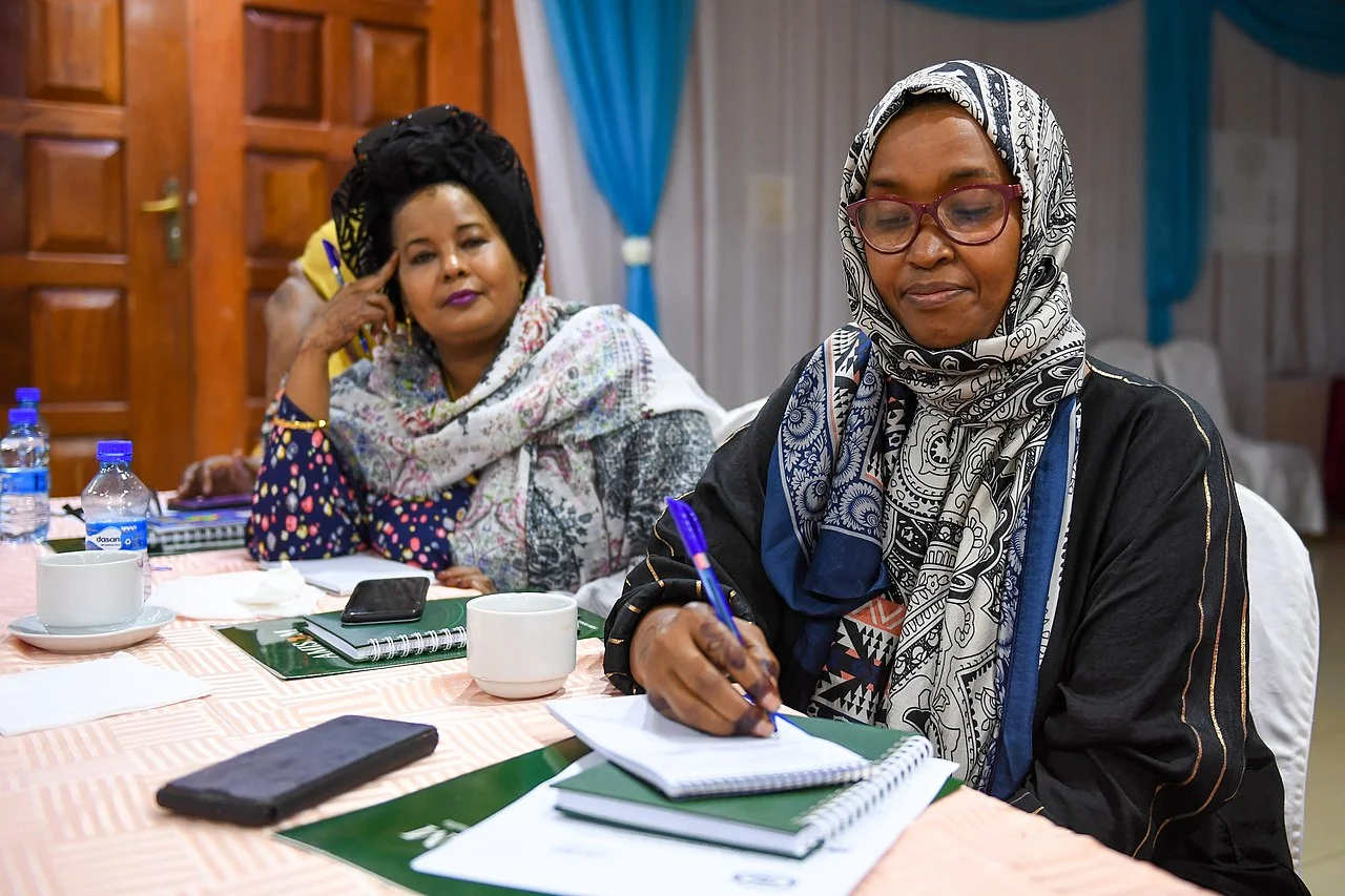 Participants taking notes at a conference in Mogadishu.