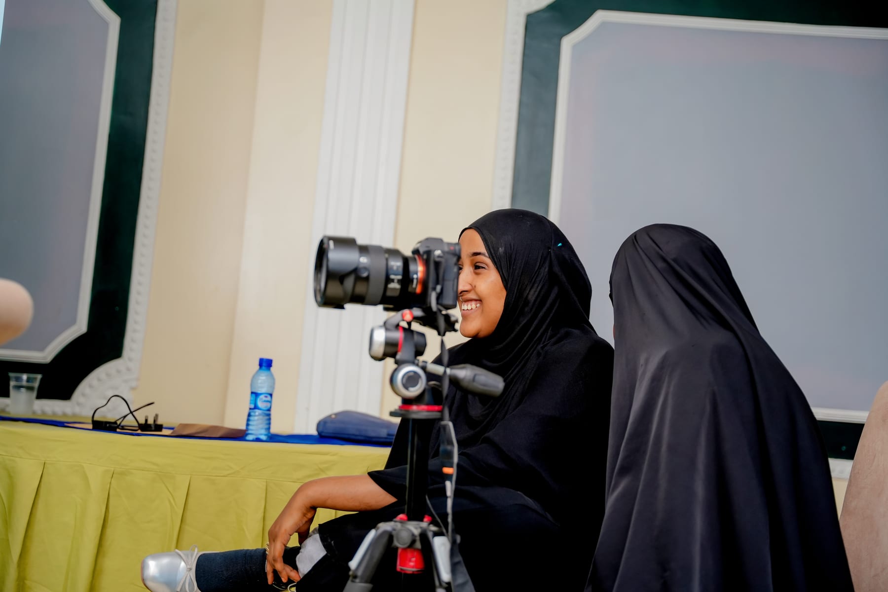 A participant operating a camera during Heen Media's audiovisual production training for Bilan Media